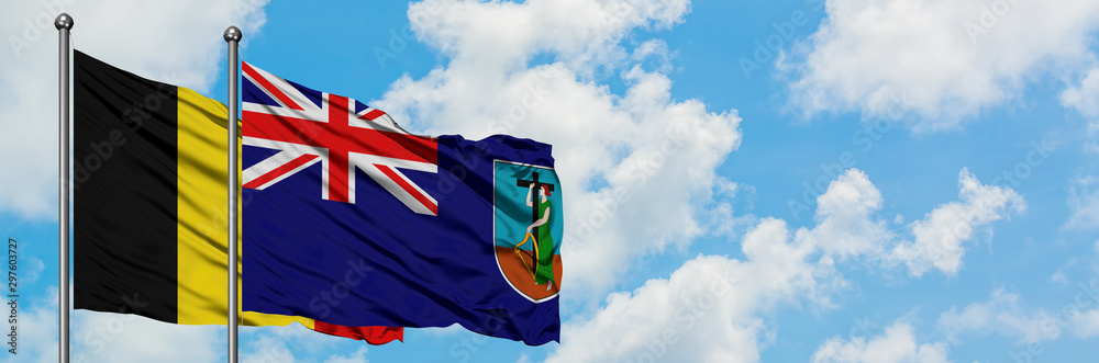 Belgium and Montserrat flag waving in the wind against white cloudy blue sky together. Diplomacy concept, international relations. Belgium and Montserrat flag waving in the wind against white cloudy blue sky together. Diplomacy concept, international relations.