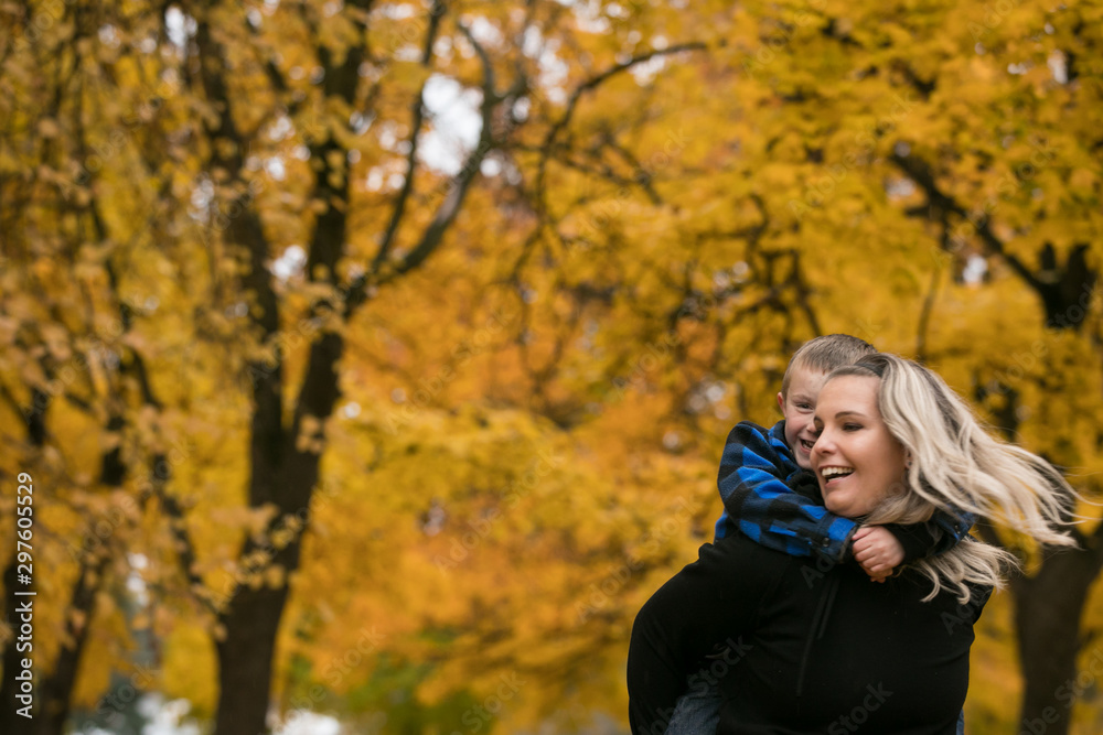 Cute mother and son piggyback Cute mother and son piggyback