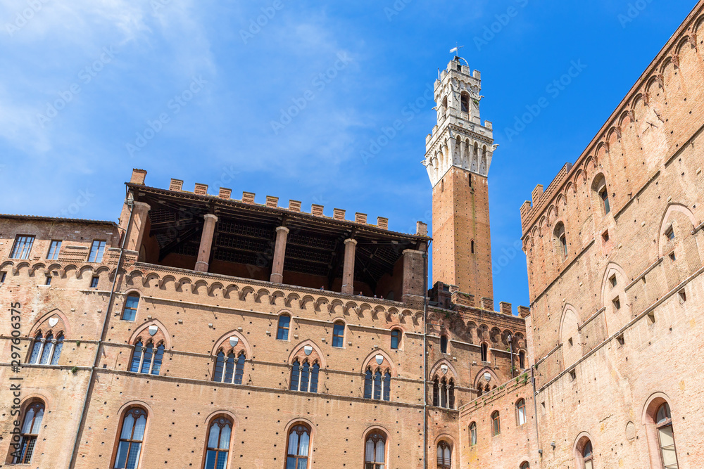 Palazzo Pubblico with the Torre del Mangia bell tower in Siena, Italy