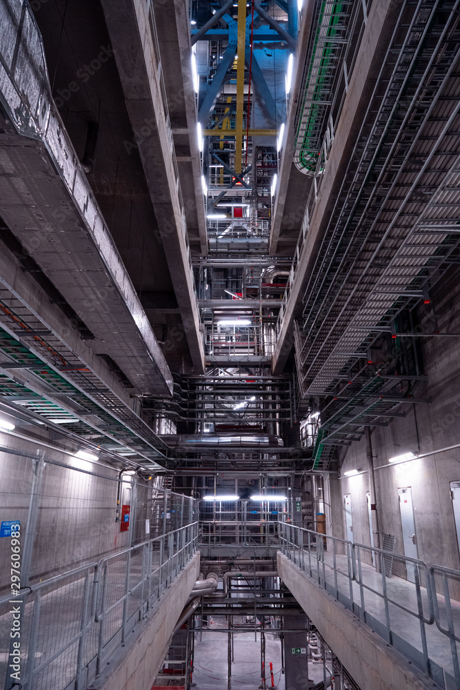 View of the plant from the outside, pipes smoke, wind turbines in the sea, barrels, tanks, thermal power plant, modern, technological waste processing plant, garbage processing plant