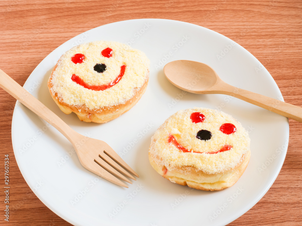 Smiley face, A smiley donut on a plate, white background
