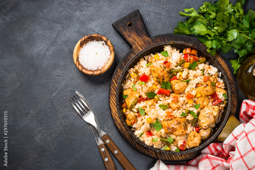 Rice with chicken and vegetables top view. Stock Photo | Adobe Stock