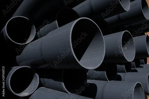 Black plastic pipelines background. Urban design.Abstract arts.Industrial material.Construction and renovation.
