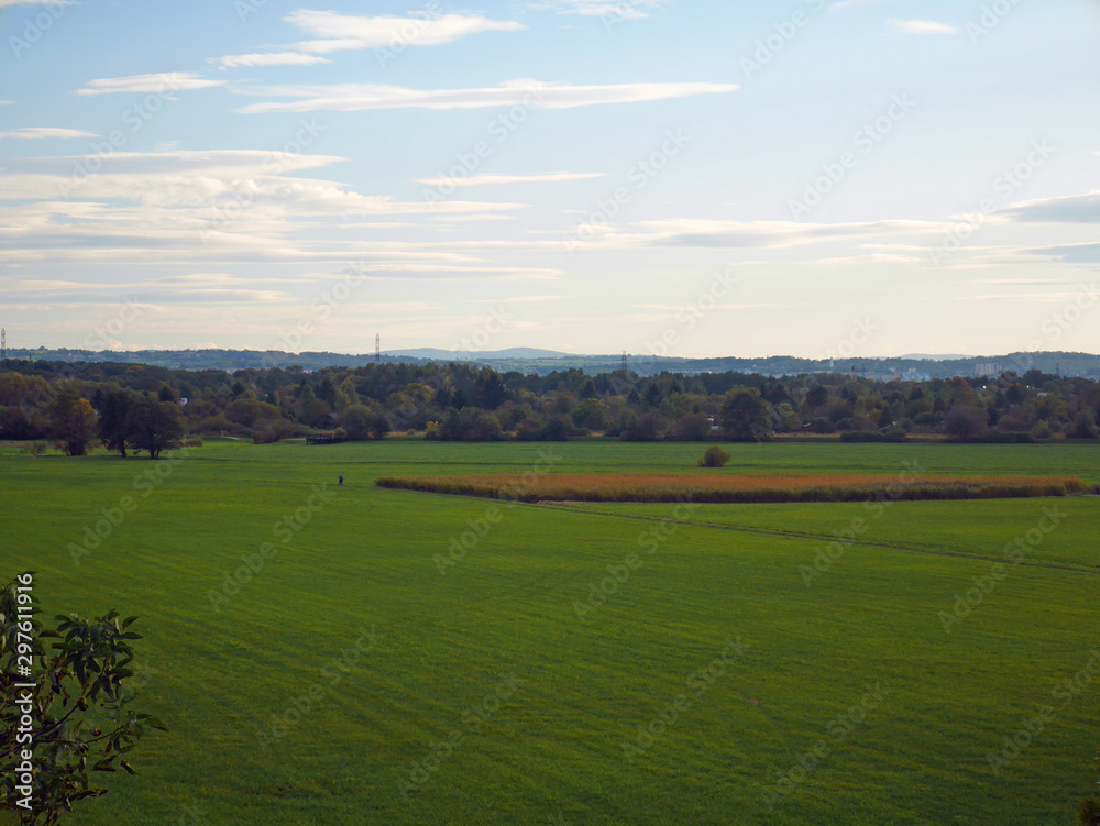 landscape with green field and blue sky farm landscape with green field and blue sky farm