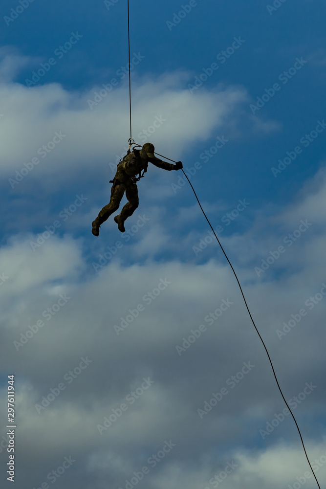 Landing of special forces on a rope from a helicopter Landing of special forces on a rope from a helicopter
