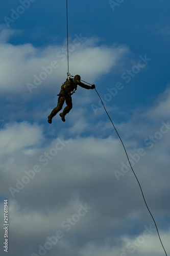 Landing of special forces on a rope from a helicopter 
