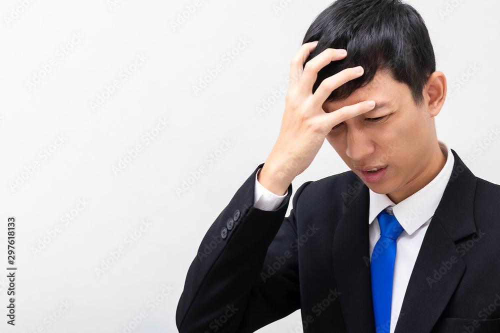 Business men wear black suits Headache from stress. Disappointed by work and profits. There is copy space on the left. Business men wear black suits Headache from stress. Disappointed by work and profits. There is copy space on the left.