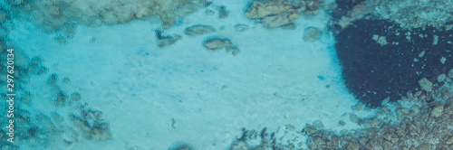 An aerial view of the beautiful Mediterranean sea  where you can se the rocky textured underwater corals and the clean turquoise water of blue lagoon Agia Napa