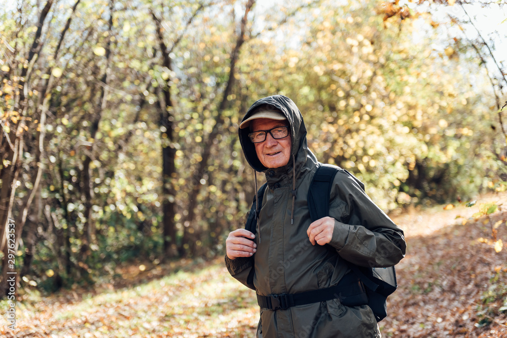 Senior man hiking on a mountain