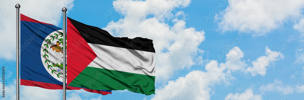 Belize and Palestine flag waving in the wind against white cloudy blue sky together. Diplomacy concept, international relations.