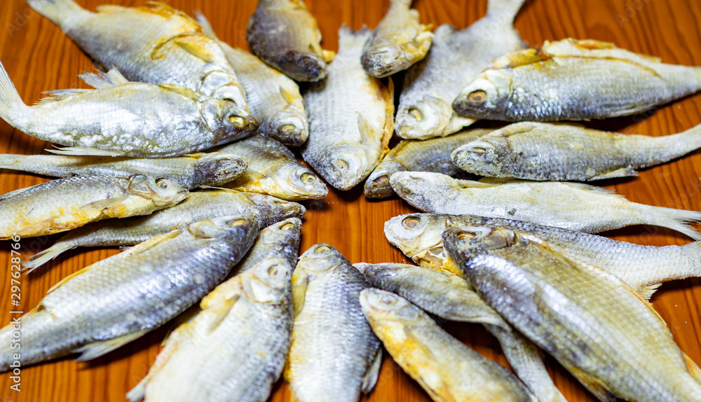 Fototapeta premium salted fish roach. . Five pieces. Beer snack. Flat position, top view.