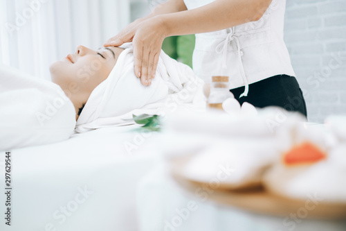 Beautiful young woman lying down on beds massage and spa at asian spa massage and beauty salon center  spa concept  massage concept
