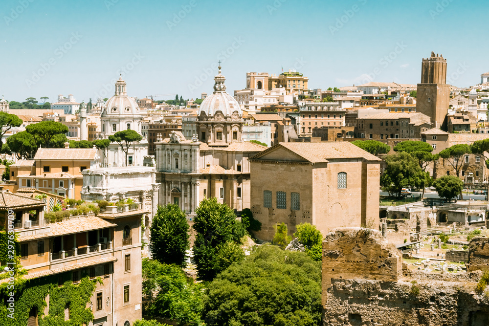 Skyline of Rome downtown in daytime in June as seen from Forum sightseeing point, Rome, Italy. 