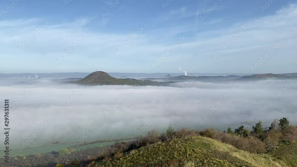 View from Rana hill.Misty morning in Central Bohemian Highlands, Czech Republic. Central Bohemian Uplands is a mountain range located in northern Bohemia. The range is about 80 km long View from Rana hill.Misty morning in Central Bohemian Highlands, Czech Republic. Central Bohemian Uplands is a mountain range located in northern Bohemia. The range is about 80 km long