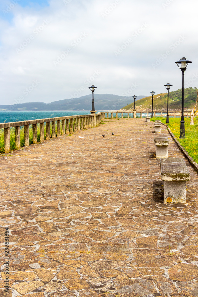 Beautiful summer promenade view with pigeons in Muxia or Mugia on the Way of St. James, Camino de Santiago, Province of A Coruna, Galicia, Spain