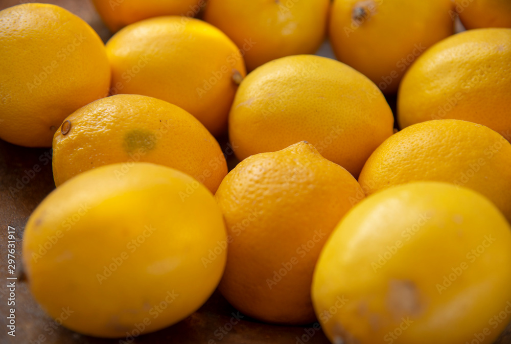 Lemon background.Selective focus. yellow fruits are stacked side by side. Lemon background.Selective focus. yellow fruits are stacked side by side.
