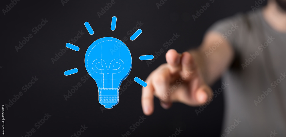 holding illuminated light bulb, idea, innovation and inspiration concept. holding illuminated light bulb, idea, innovation and inspiration concept.