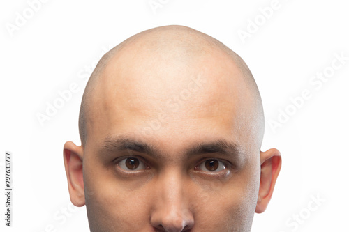 Photo of young shaved man's head on white photo