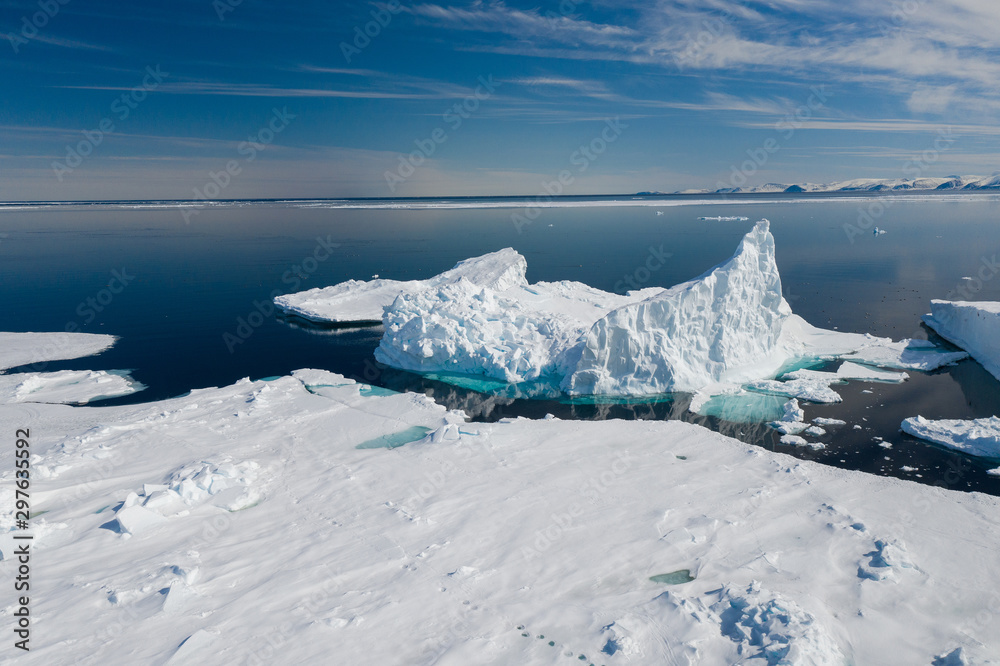 Aerial drone photo of tourists visit the floe edge near Sirmilik National Park in Nunavut, Canadaa