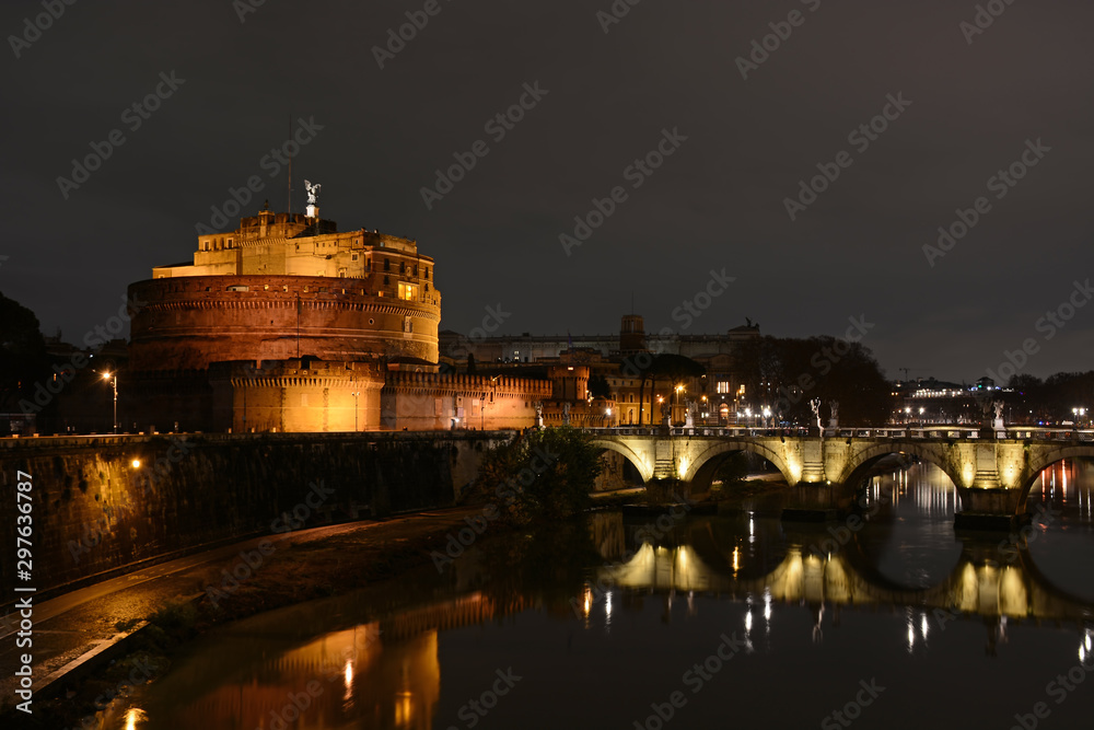 Castel Sant'Angelo and Ponte Saint Angelo bridge by night in Rome, Italy