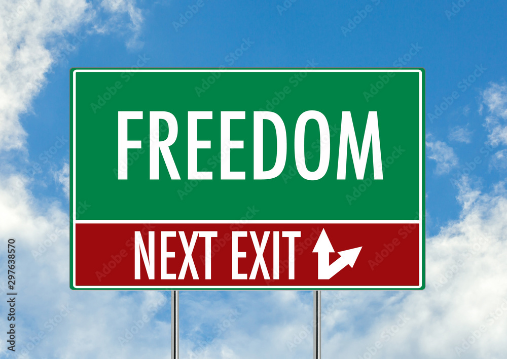 Next exit for freedom green road sign over blue sky background. Concept road sign collection. Next exit for freedom green road sign over blue sky background. Concept road sign collection.