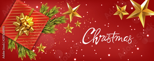 Merry christmas banner with golden ribbon gift box, fir tree leaves and golde...