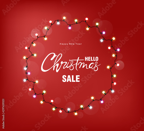 Christmas sale greeting card with white fairy lights on wreath. Red backgroun...