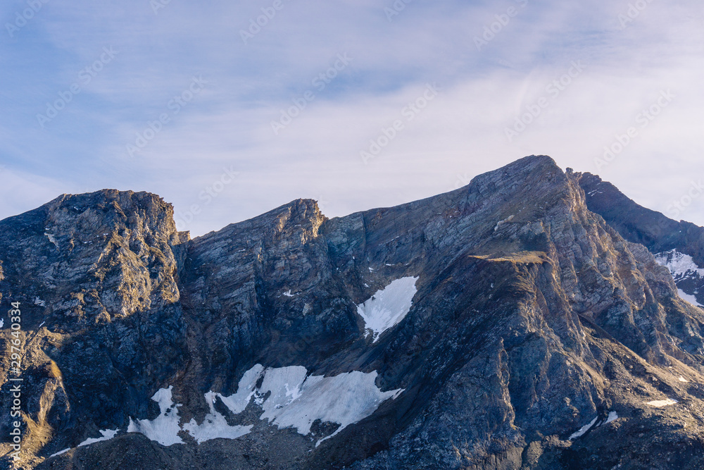 The sunset and the last lights of the day in the mountains near Lake Morasco, Italy - October 2019.