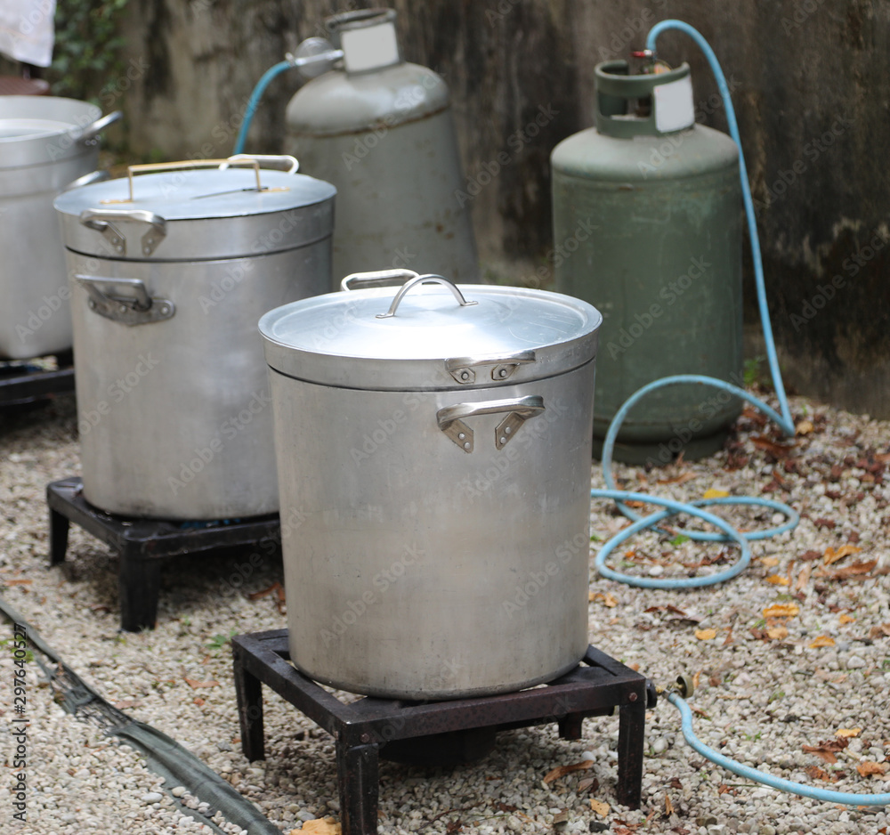 outdoor kitchen with many big cauldrons without people outdoor kitchen with many big cauldrons without people