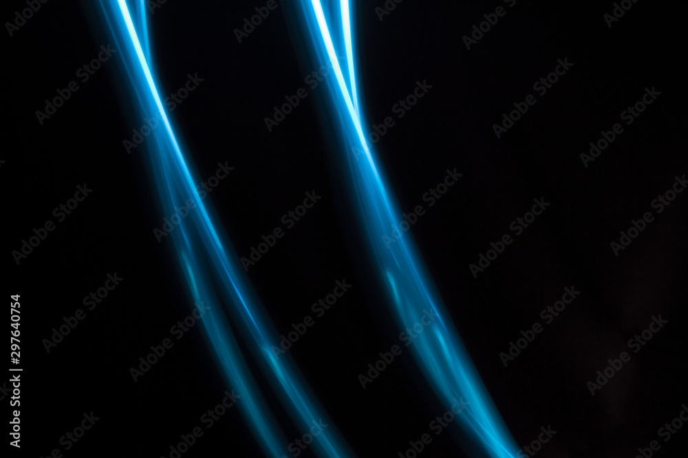 blue light lines on a black background blue light lines on a black background