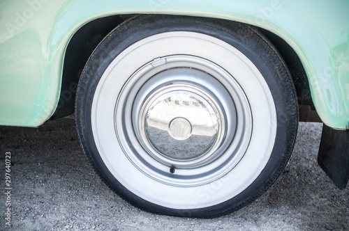 Whitewall tire mounted on restored 60s car © WH_Pics