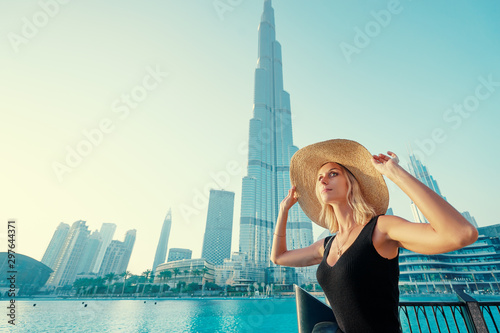 Photography Young travelling woman enjoying the view of Dubai downtown.