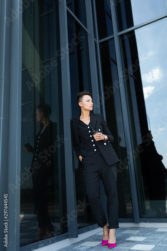 portrait of a successful businesswoman on the background of a skyscraper