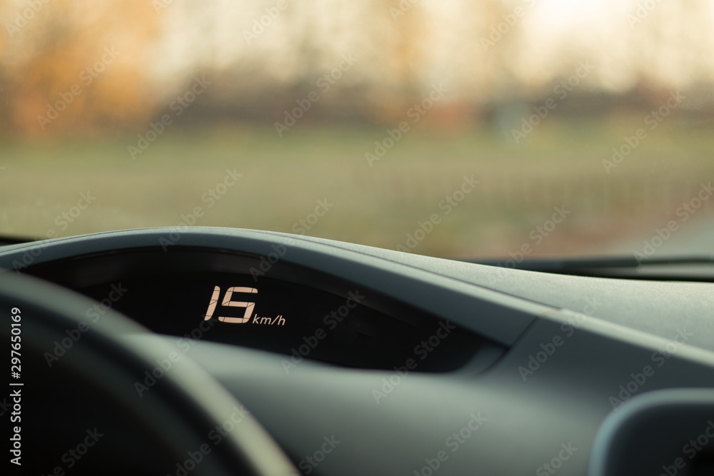 The dashboard of the car with a speed of 15 km / h on the speedometer ...