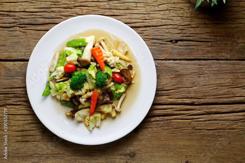 Stir-fried mixed vegetable and mushroom with Oyster sauce on white plate