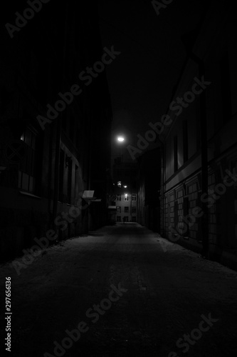 winter night street lit by a lonely lantern