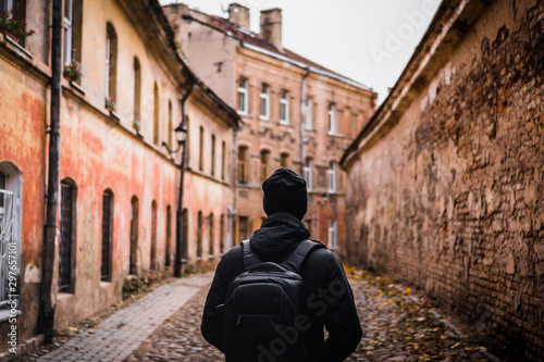 Fototapeta Naklejka Na Ścianę i Meble -  man walking at vilnius old town, lithuania