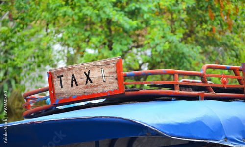 Taxi service vintage sign in country of Laos photo