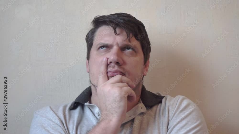 close-up portrait of a funny pensive man.business concept.comic emotional character thinks about something. close-up portrait of a funny pensive man.business concept.comic emotional character thinks about something.
