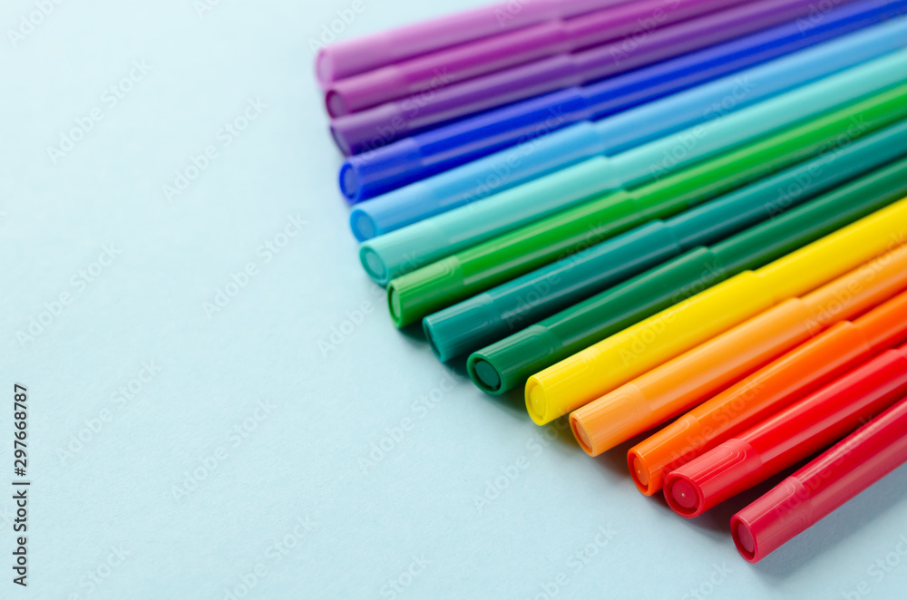 Colored felt tip pens composition on blue background. Colored felt tip pens composition on blue background.