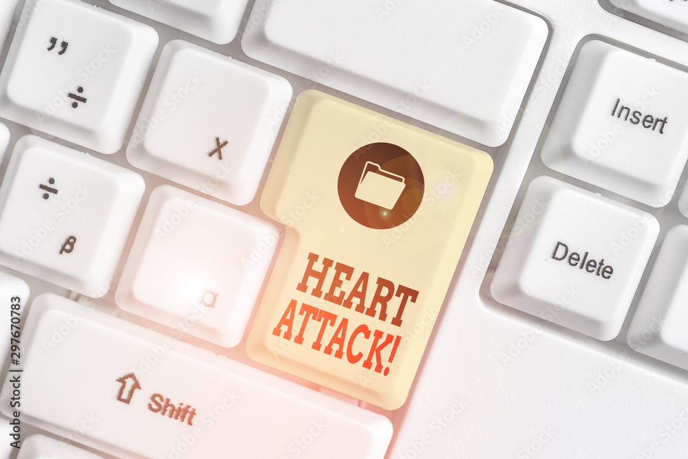 Text sign showing Heart Attack. Business photo showcasing sudden occurrence of coronary thrombosis resulting in death White pc keyboard with empty note paper above white background key copy space Text sign showing Heart Attack. Business photo showcasing sudden occurrence of coronary thrombosis resulting in death White pc keyboard with empty note paper above white background key copy space