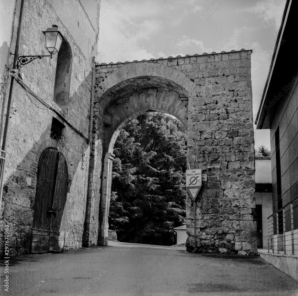 The old narrow streets in the medieval town of Massa Marittima in Tuscany shot with analogue film technique - 4