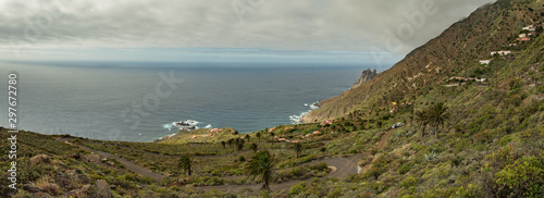 Rocky coastline with sharp cliffs in the ocean on the North of La Gomera island near Arguamul village where you can get along the narrow winding serpatine. Canary Islands, Spain