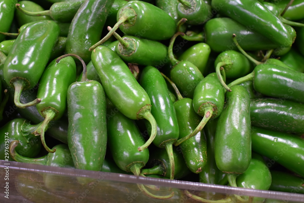 green jalapeno peppers at the market green jalapeno peppers at the market