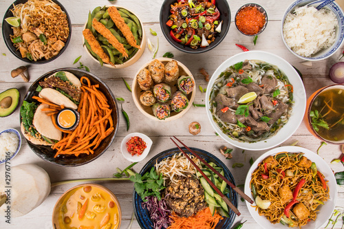 Asian food background with various ingredients on rustic stone background , top view. Vietnam or Thai cuisine. © Lukas Gojda