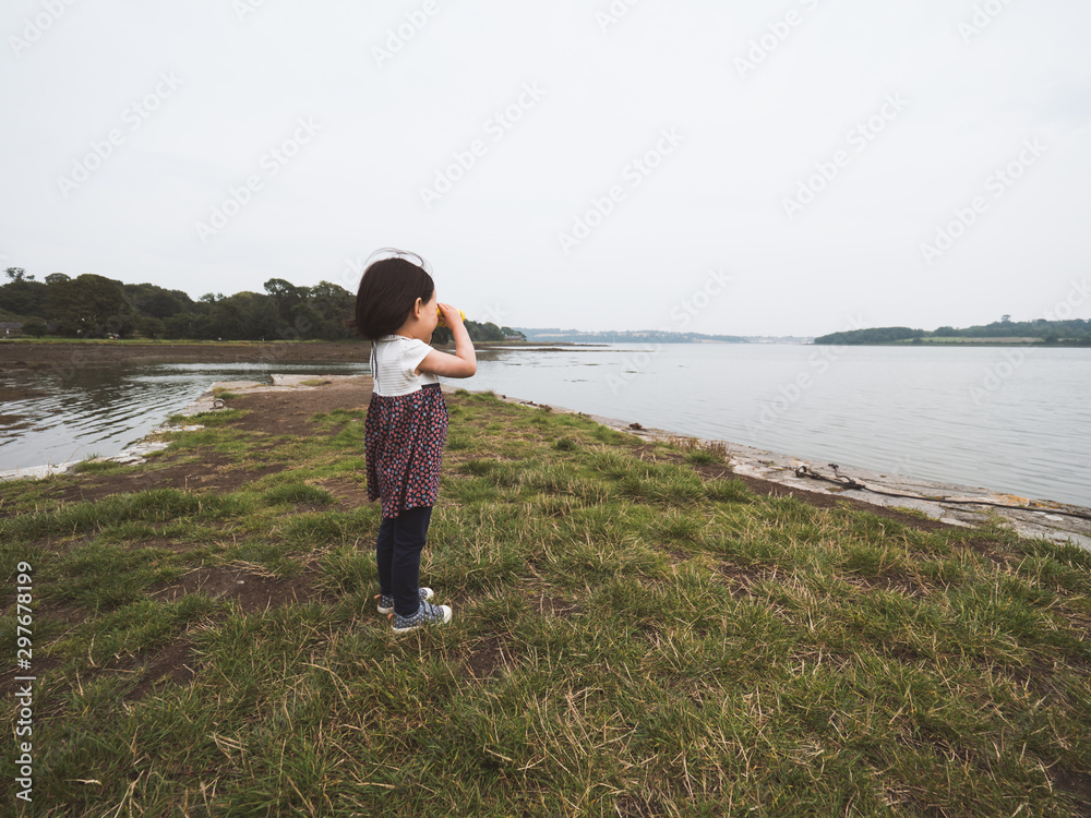 toddler girl playing exploration at foggy summer countryside,Northern Ireland toddler girl playing exploration at foggy summer countryside,Northern Ireland