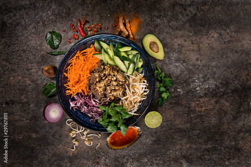 Bun bo nam bo asian food background with various ingredients on rustic stone , top view. Vietnam or Thai cuisine. photo