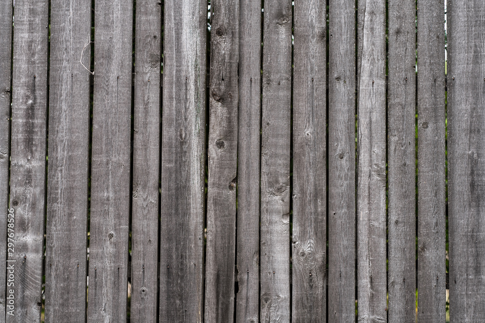 old wooden fence rotten texture boards. Background old wooden fence rotten texture boards. Background