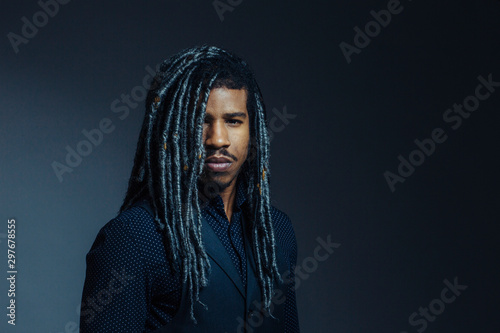 Canvas-taulu Portrait of a  serious young man with cool hair  and cool black and gray hair in