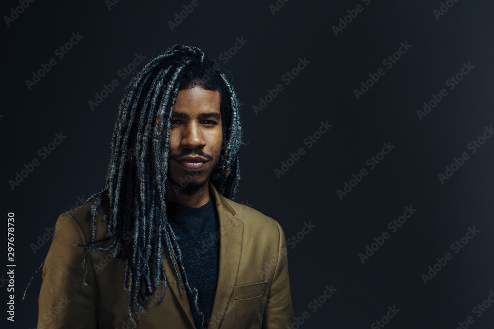 Portrait of a young man with cool hair in studio